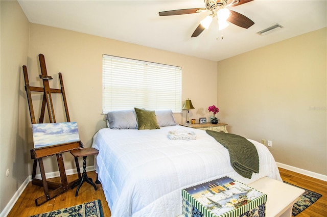 bedroom featuring ceiling fan and wood-type flooring