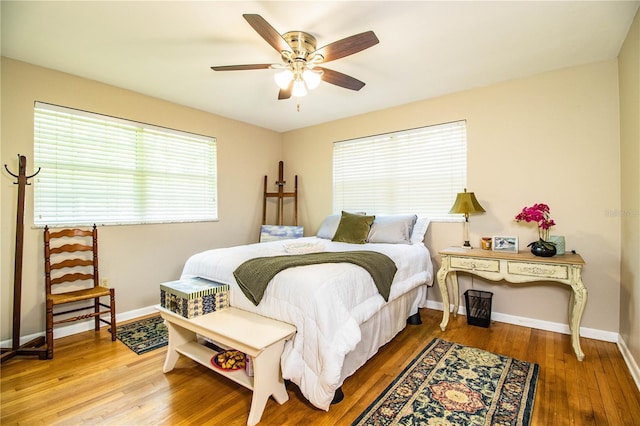 bedroom featuring ceiling fan and hardwood / wood-style floors