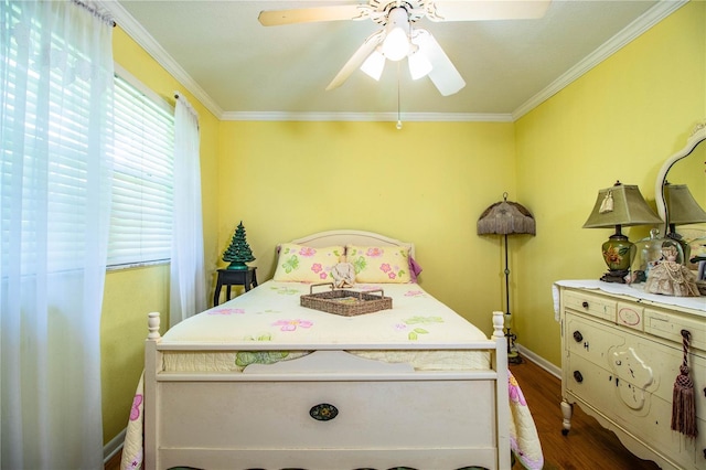 bedroom featuring hardwood / wood-style flooring, ceiling fan, and ornamental molding