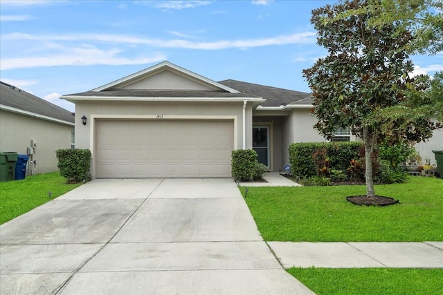 single story home with a garage and a front lawn