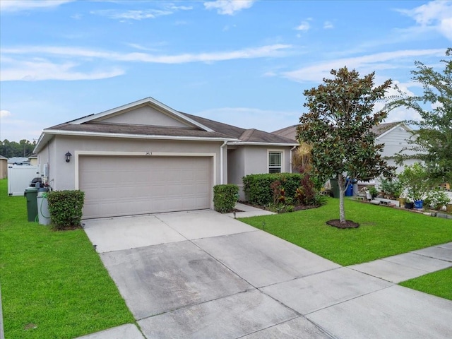 ranch-style home with a garage and a front lawn