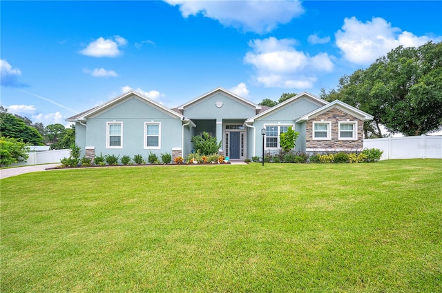 single story home with a front lawn