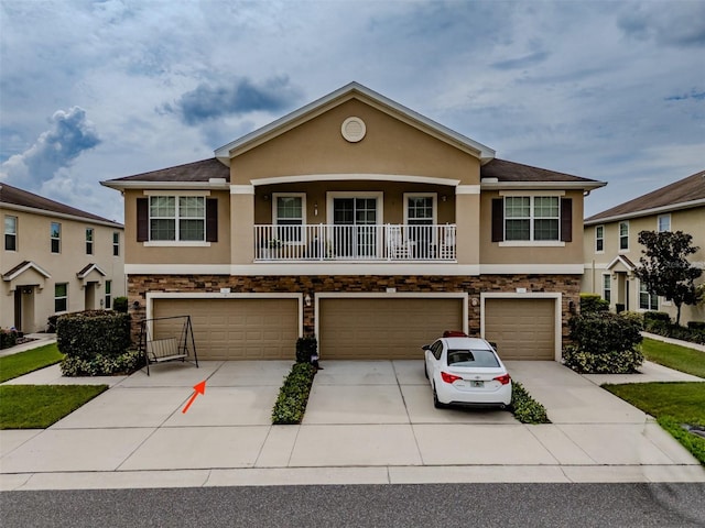 townhome / multi-family property featuring a garage