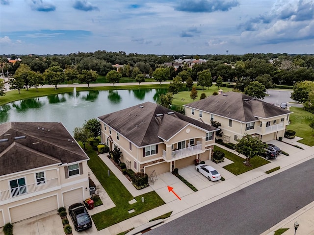 birds eye view of property with a water view