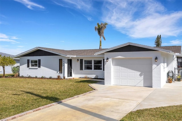 ranch-style home with a garage and a front yard