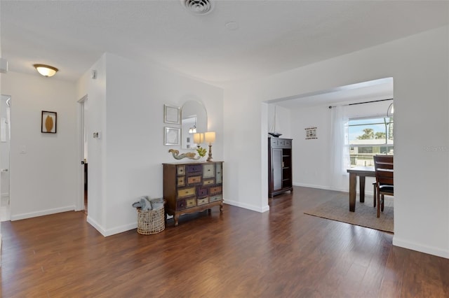 hallway featuring dark wood-type flooring