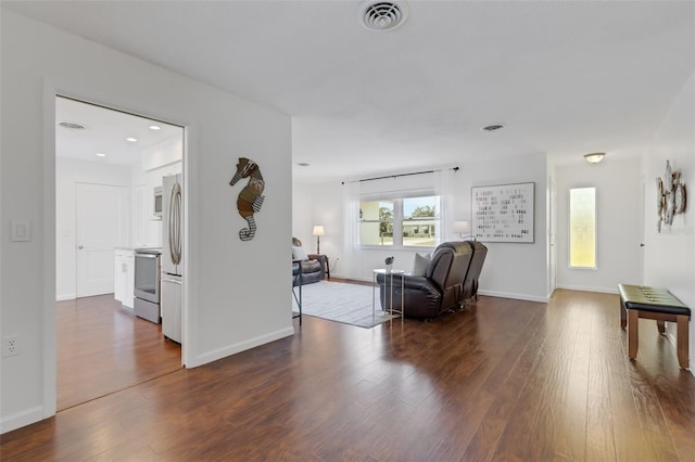 living room featuring dark hardwood / wood-style flooring