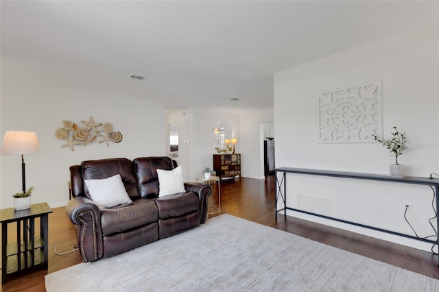 living room with dark wood-type flooring