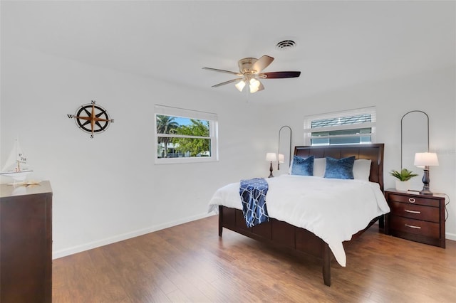 bedroom featuring hardwood / wood-style floors and ceiling fan