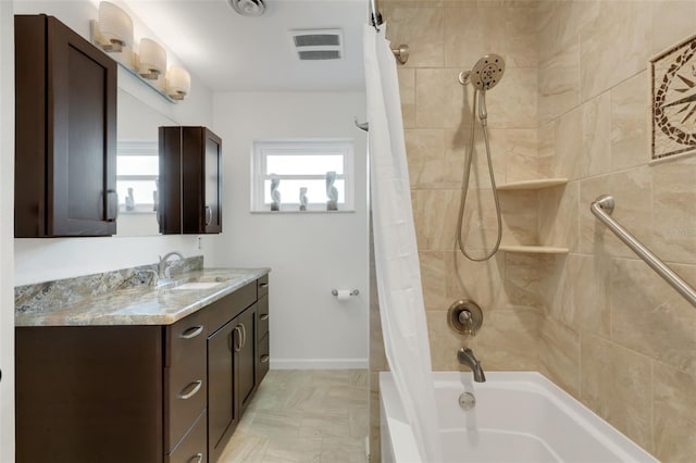 bathroom with vanity and shower / bath combination with curtain