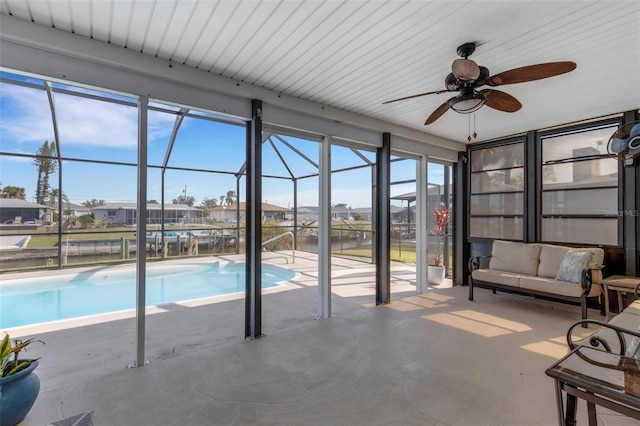 view of swimming pool featuring ceiling fan