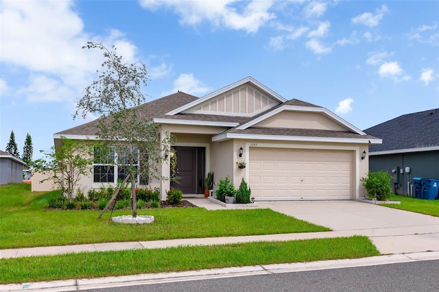 view of front of house featuring a front yard and a garage