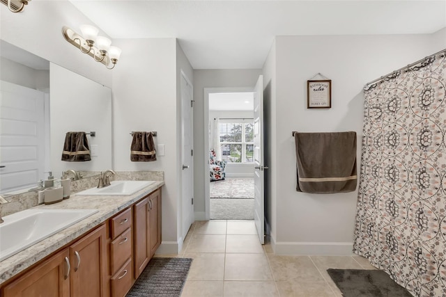 bathroom with tile patterned flooring and vanity