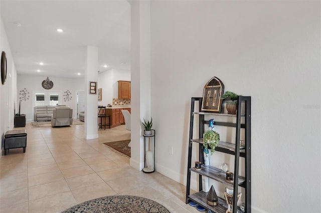 hallway with light tile patterned floors