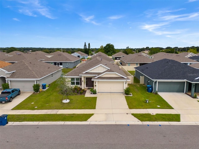 view of front facade with a front yard and a garage