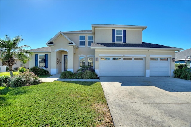 view of front property with a garage and a front lawn