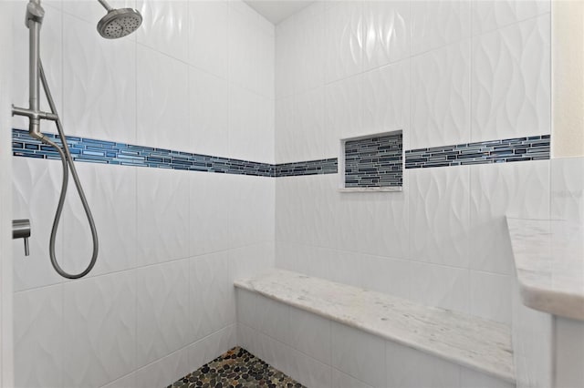 bathroom featuring tiled shower