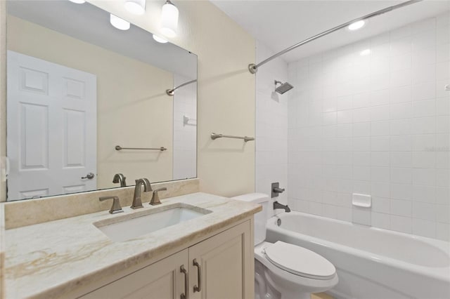 full bathroom with vanity, toilet, and tiled shower / bath combo