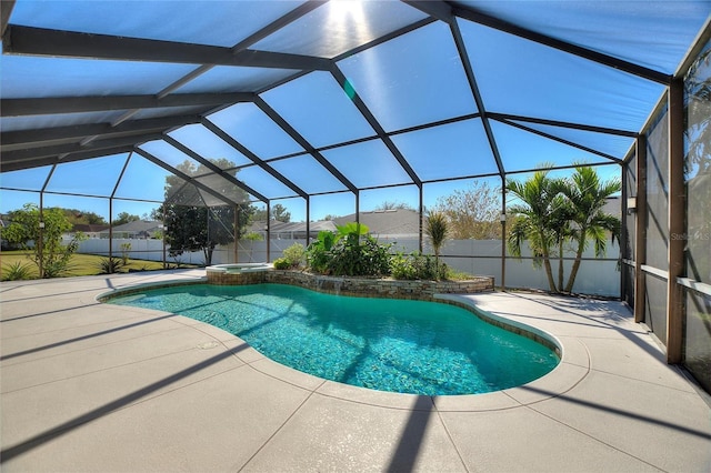 view of pool featuring an in ground hot tub, a lanai, and a patio area