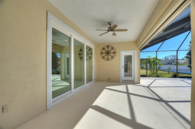 sunroom / solarium featuring ceiling fan