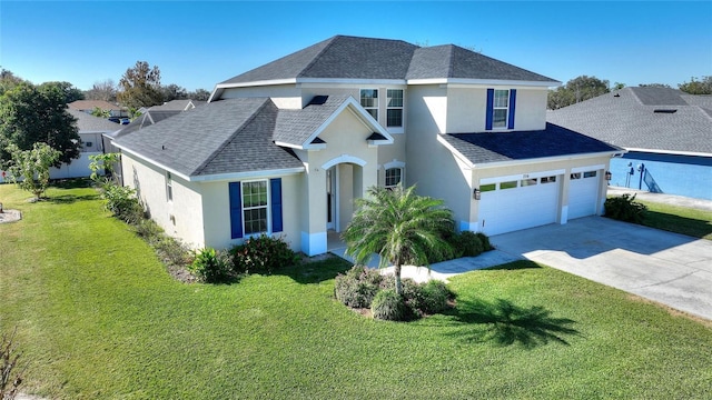 view of front of house featuring a garage and a front lawn