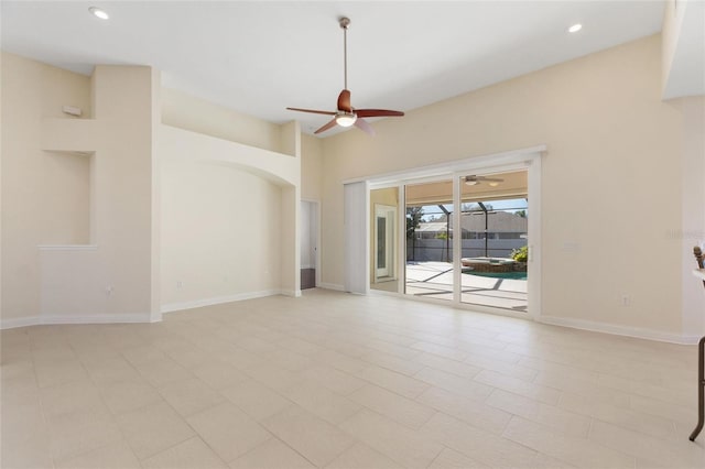 unfurnished living room with ceiling fan