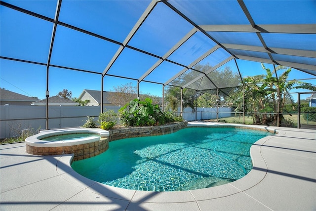 view of pool with an in ground hot tub, a lanai, and a patio area