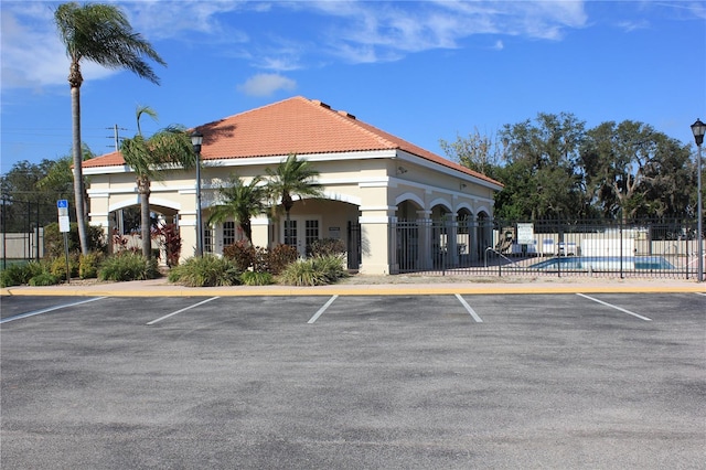 view of building exterior with a community pool