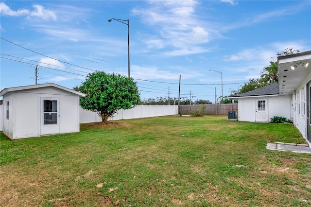 4618 Crestview Ln, Lakeland, FL 33813 - view of yard featuring central air condition unit and an outbuilding