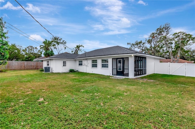 4618 Crestview Ln, Lakeland, FL 33813 - rear view of house featuring central air condition unit, a sunroom, a gate, and stucco siding