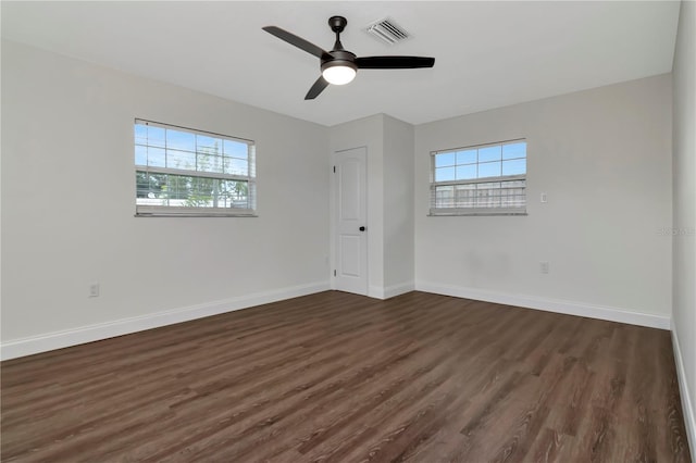 4618 Crestview Ln, Lakeland, FL 33813 - unfurnished room with healthy amount of natural light, dark wood finished floors, and a ceiling fan