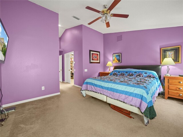 bedroom featuring carpet flooring, vaulted ceiling, and ceiling fan