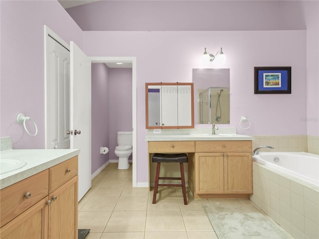 full bathroom with independent shower and bath, tile patterned flooring, vanity, and toilet