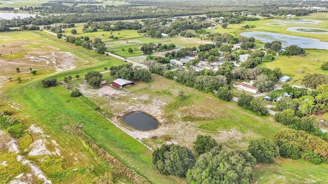 bird's eye view featuring a water view and a rural view