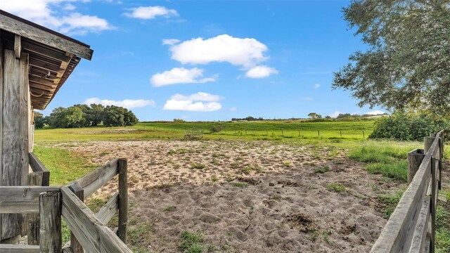 view of yard with a rural view