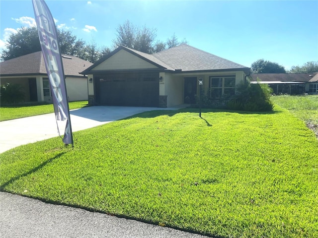 ranch-style home featuring a garage, driveway, a front lawn, and roof with shingles