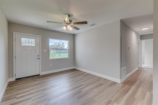 entrance foyer with ceiling fan and light hardwood / wood-style flooring