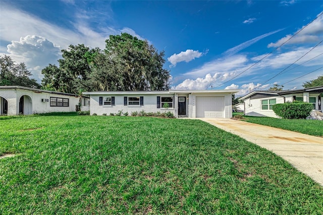 single story home with a front yard and a garage