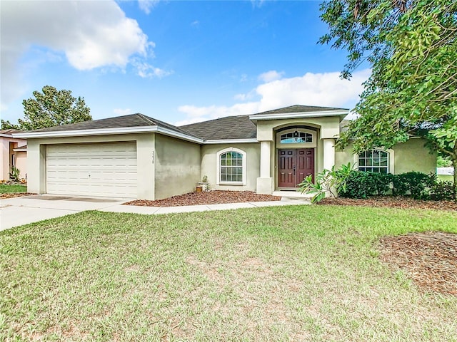 single story home featuring a front yard and a garage