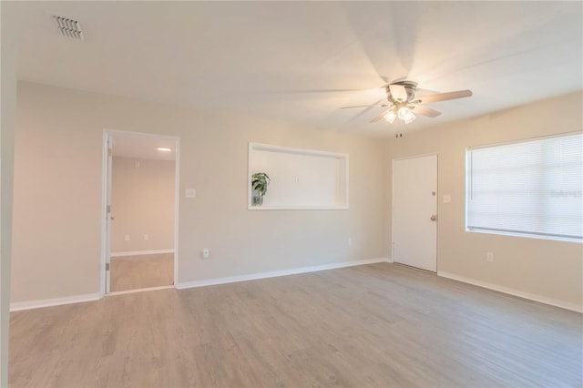 unfurnished room featuring ceiling fan and light hardwood / wood-style flooring