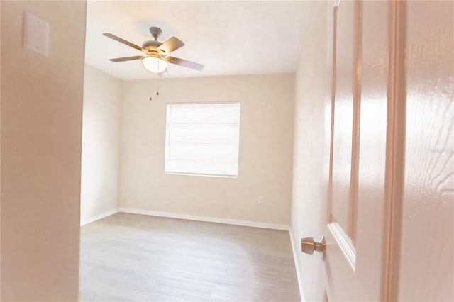 unfurnished room featuring ceiling fan and light hardwood / wood-style floors