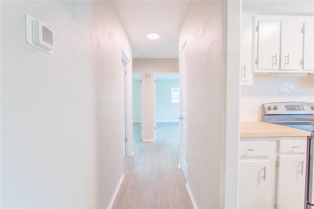 hallway with light wood-type flooring