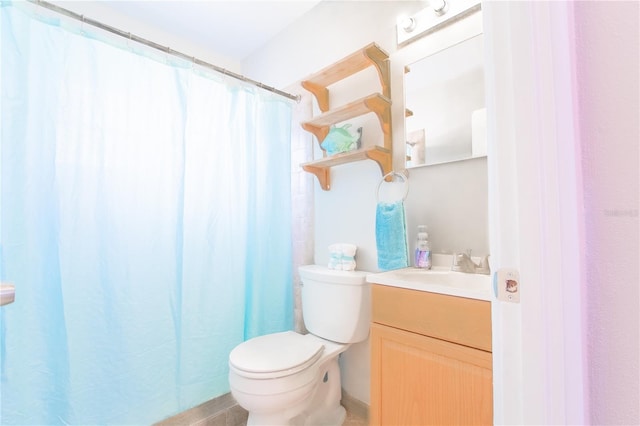 bathroom featuring tile patterned flooring, vanity, toilet, and a shower with curtain