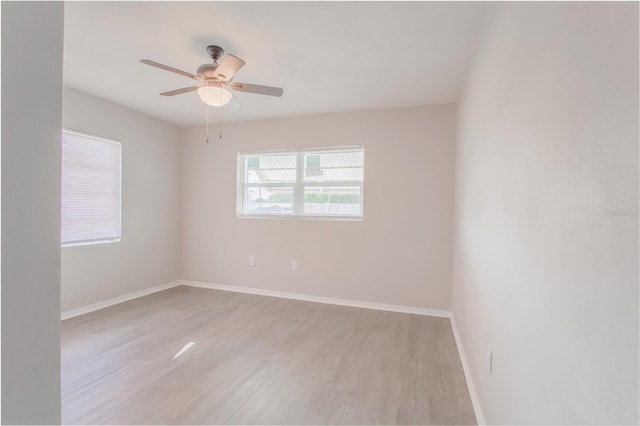 unfurnished room featuring ceiling fan and light hardwood / wood-style floors