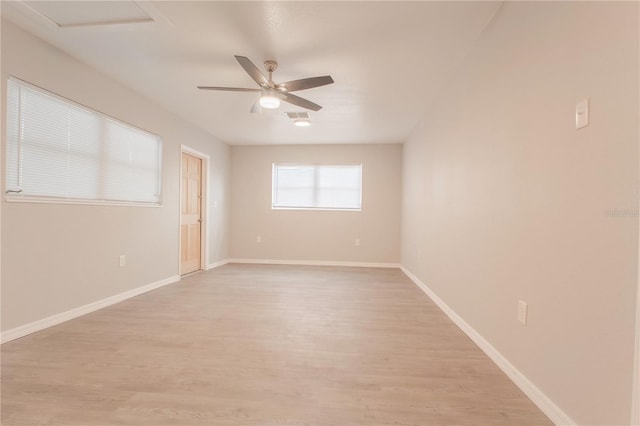 empty room featuring ceiling fan and light hardwood / wood-style flooring