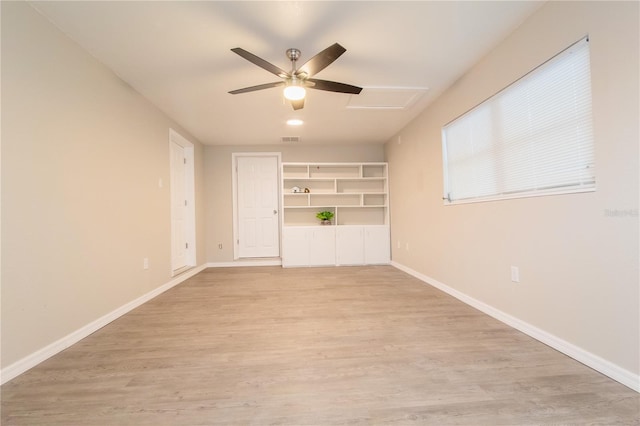 unfurnished living room featuring ceiling fan and light hardwood / wood-style flooring