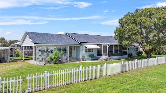 single story home featuring a sunroom and a front lawn