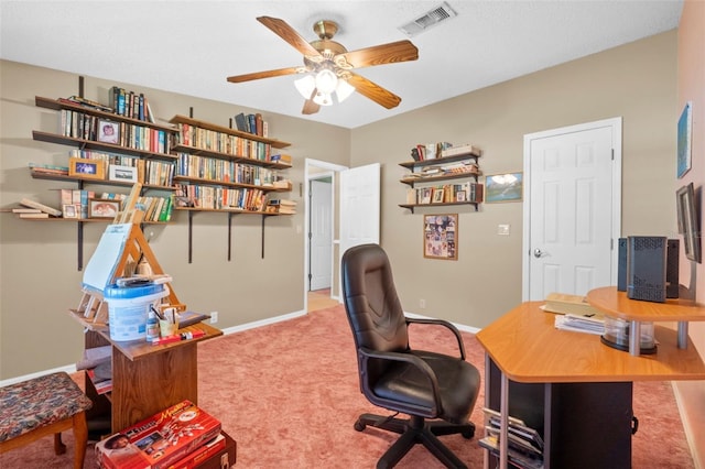 carpeted home office with ceiling fan