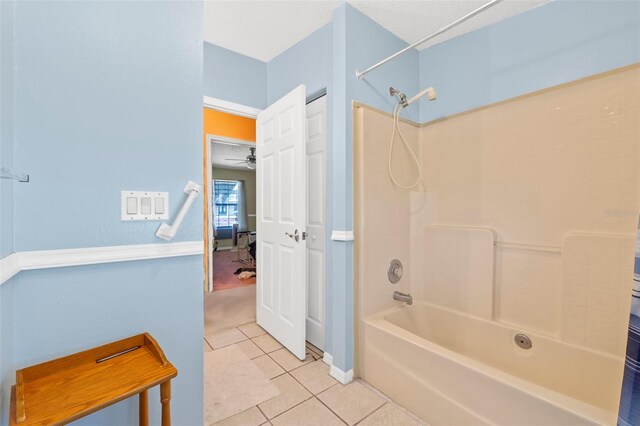 bathroom with ceiling fan, tile patterned flooring, and shower / bath combo