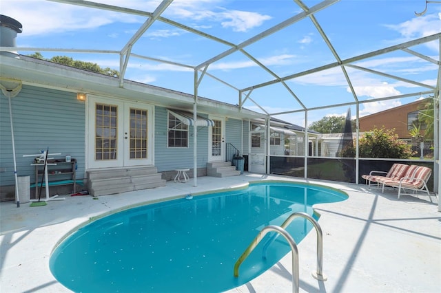 view of pool with a lanai and a patio